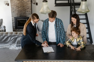 Homeowners signing paperwork